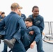 Sailors conduct simulated drills aboard USS Ralph Johnson (DDG 114), 27 June.