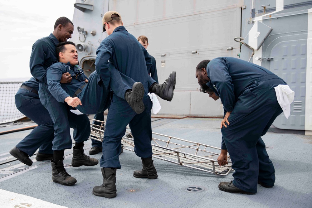 Sailors conduct simulated drills aboard USS Ralph Johnson (DDG 114), 27 June.