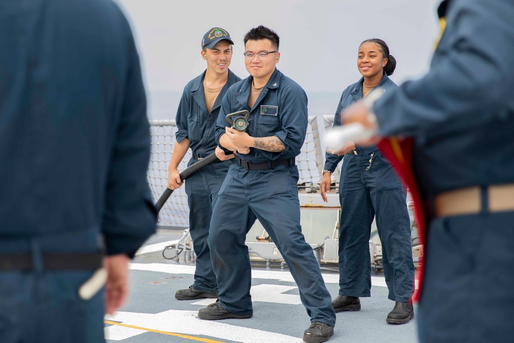 Sailors conduct simulated drills aboard USS Ralph Johnson (DDG 114), 27 June.