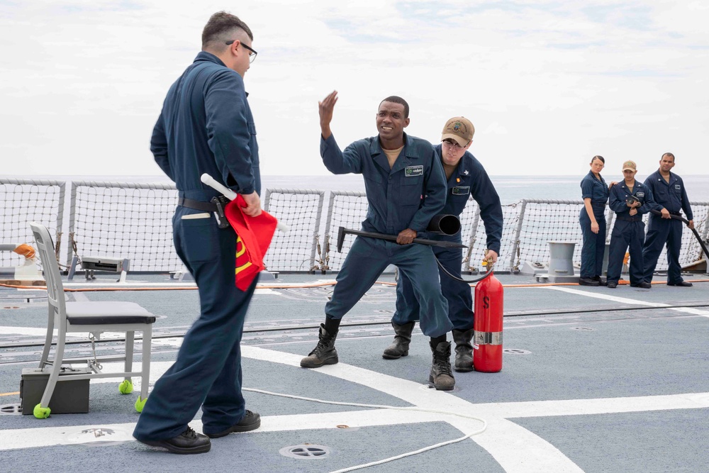 Sailors conduct simulated drills aboard USS Ralph Johnson (DDG 114), 27 June.