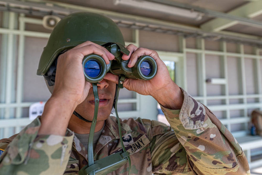 Army Reserve Capt. Kevin Tirado scans his target