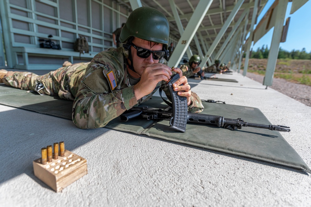 Army Reserve Sgt. Denzel Torres loads his magazine