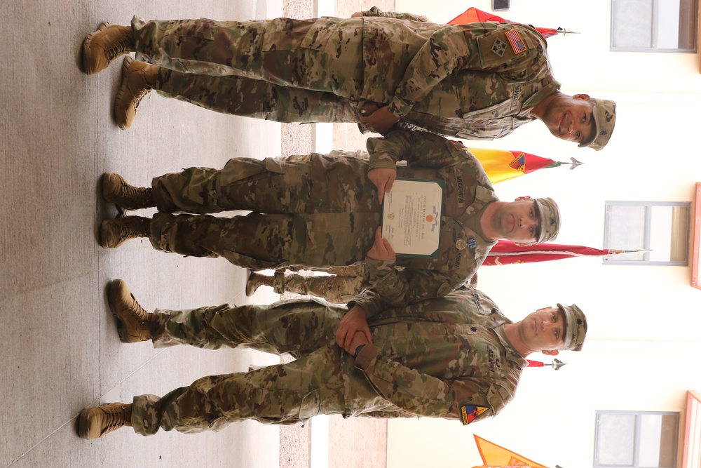 Sgt. Megowan Poses with award