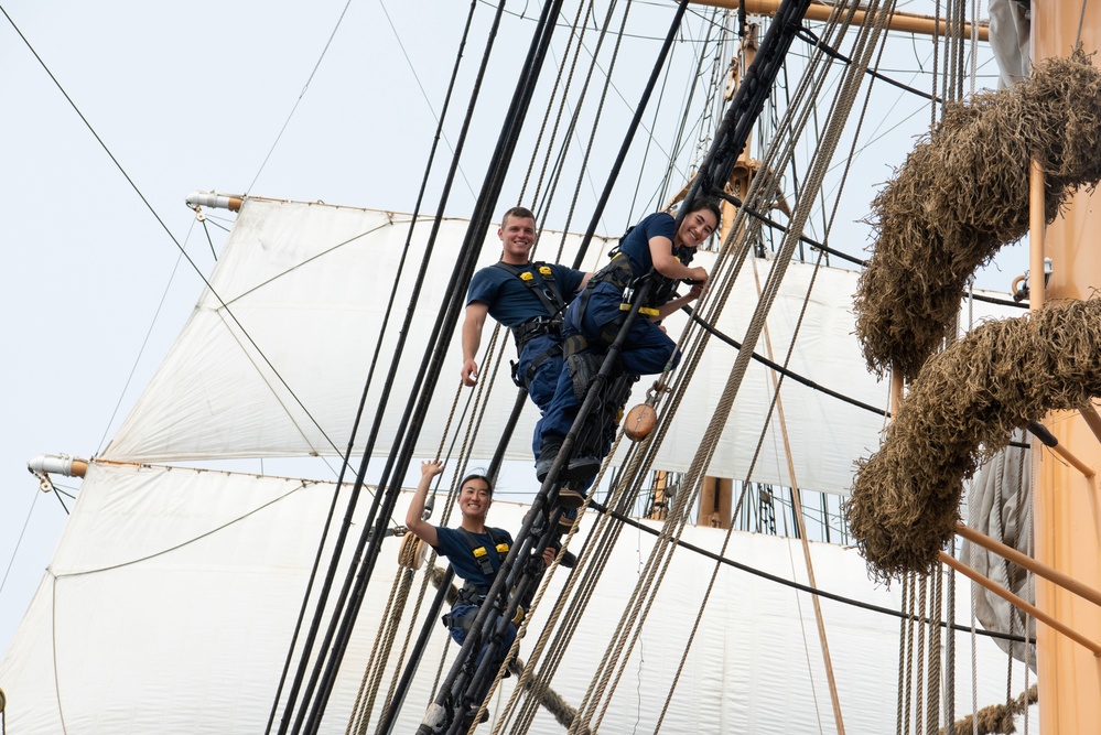 Cadets climb rigging on USCGC Eagle