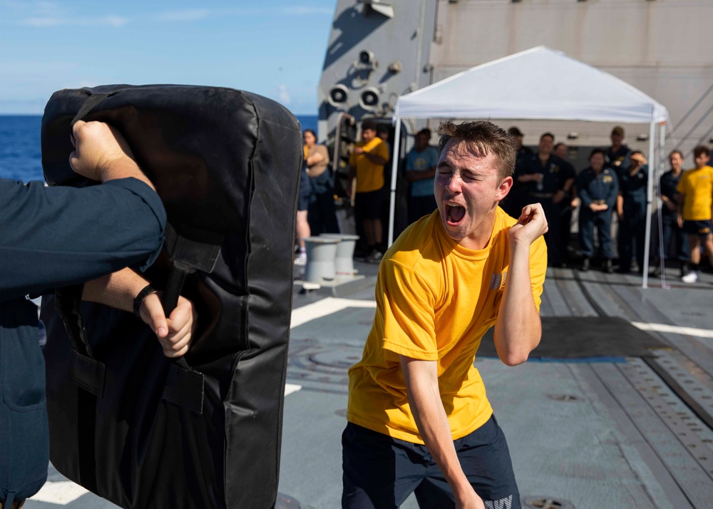 Sailors participate in an oleoresin capsicum (OC) course aboard USS Ralph Johnson (DDG 114), 28 June.