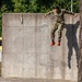 Army Reserve Sgt. Denzel Torres Jumps from an obstacle