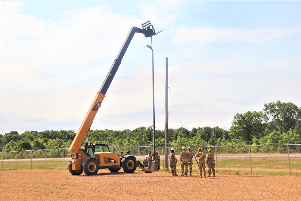 389th Engineer Company supports troop project to install light poles in Fort McCoy’s CRSP yard