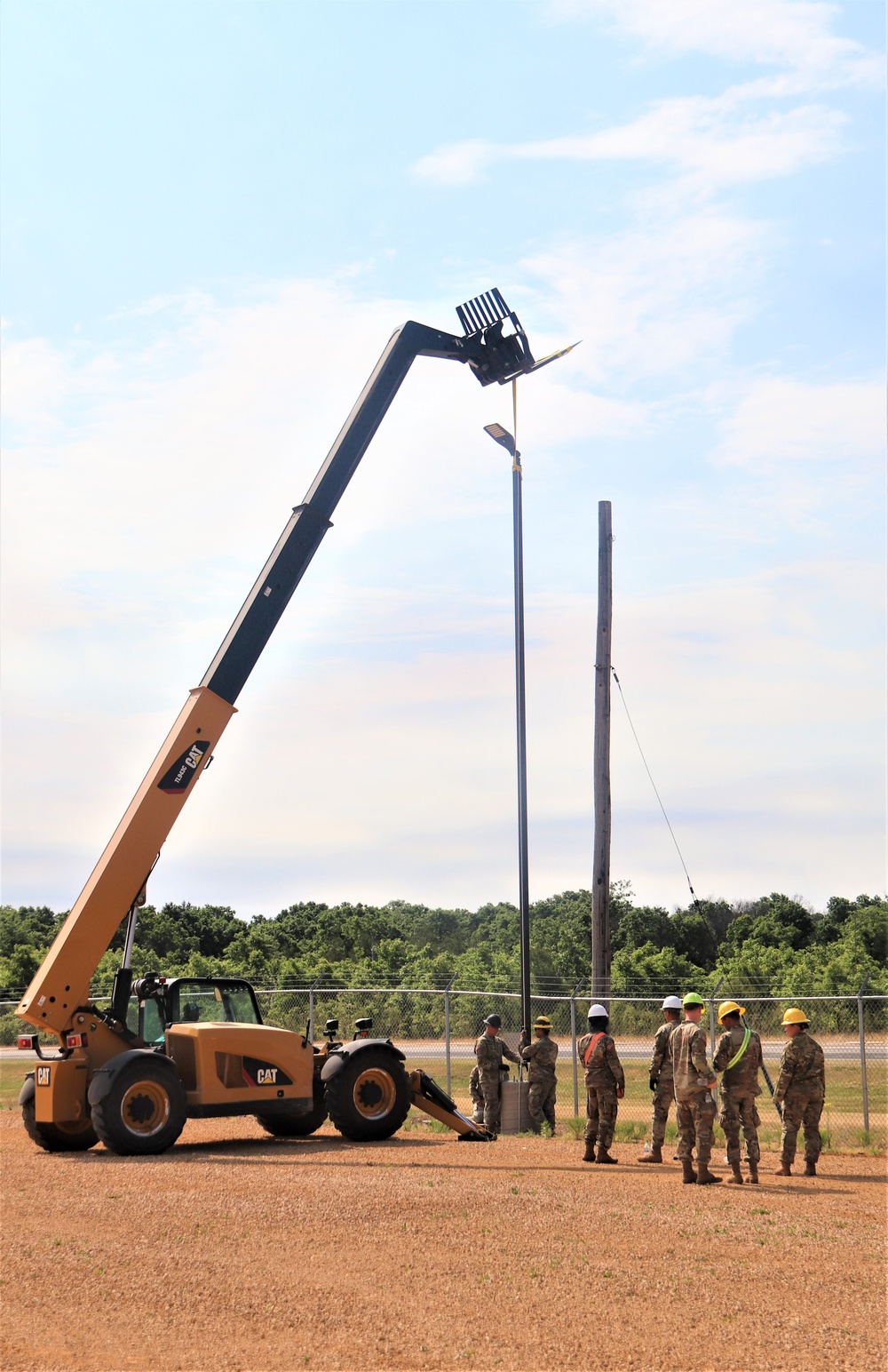 389th Engineer Company supports troop project to install light poles in Fort McCoy’s CRSP yard