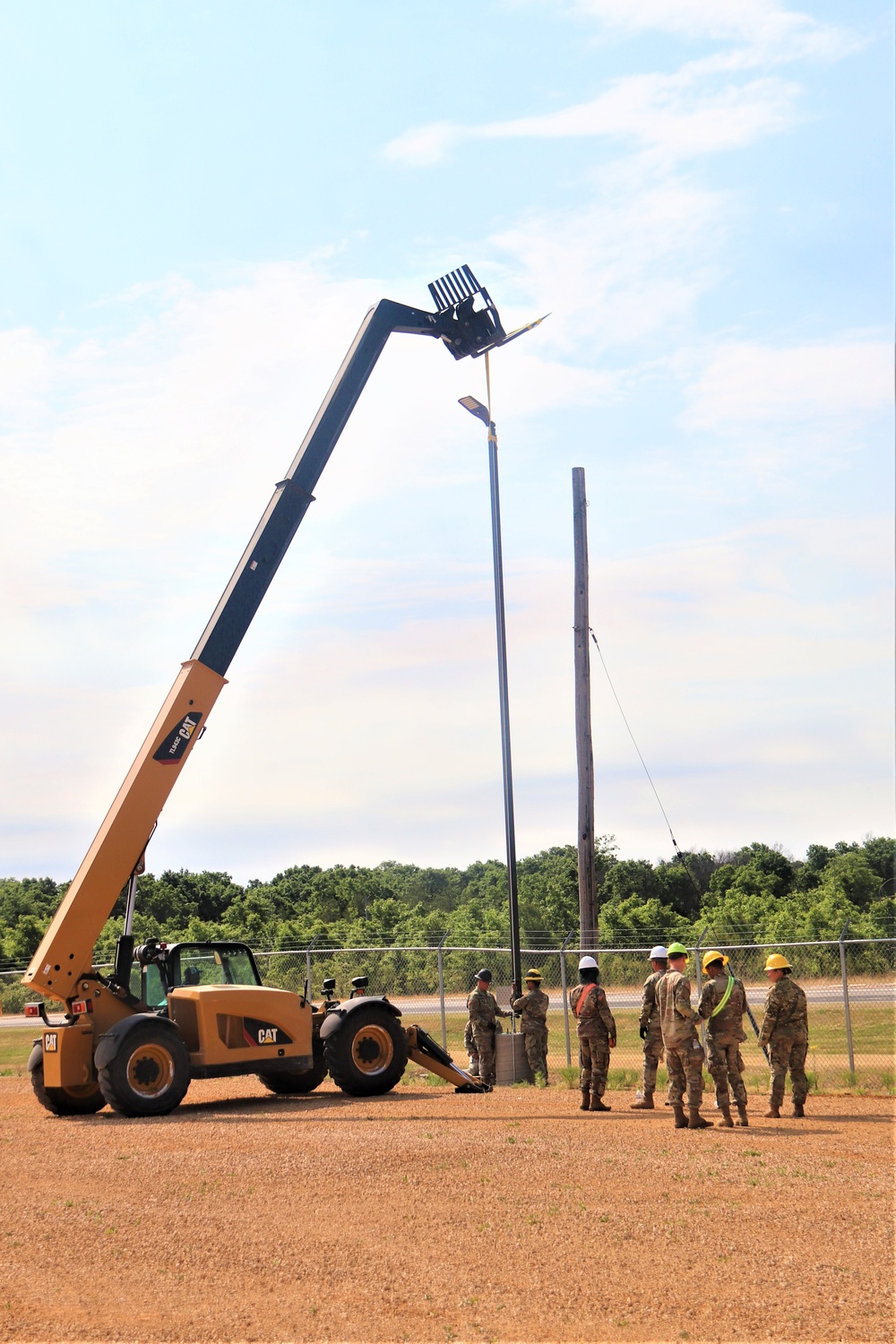 389th Engineer Company supports troop project to install light poles in Fort McCoy’s CRSP yard