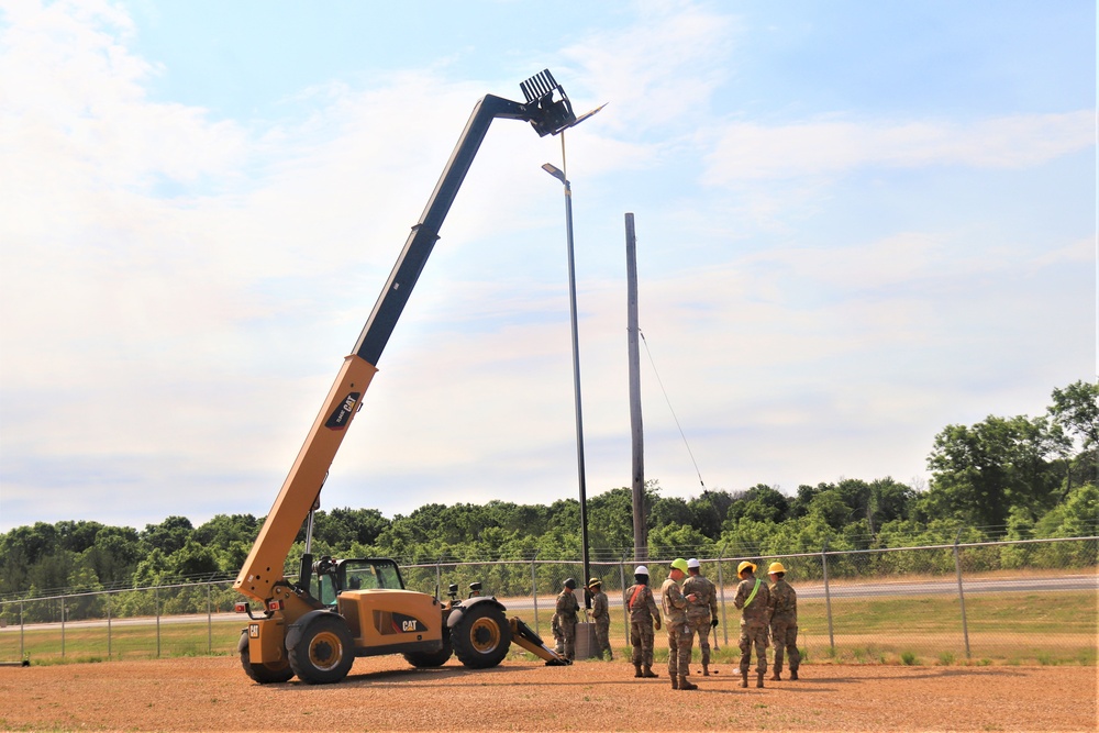 389th Engineer Company supports troop project to install light poles in Fort McCoy’s CRSP yard