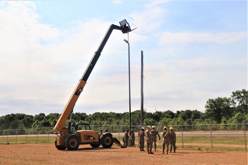 389th Engineer Company supports troop project to install light poles in Fort McCoy’s CRSP yard