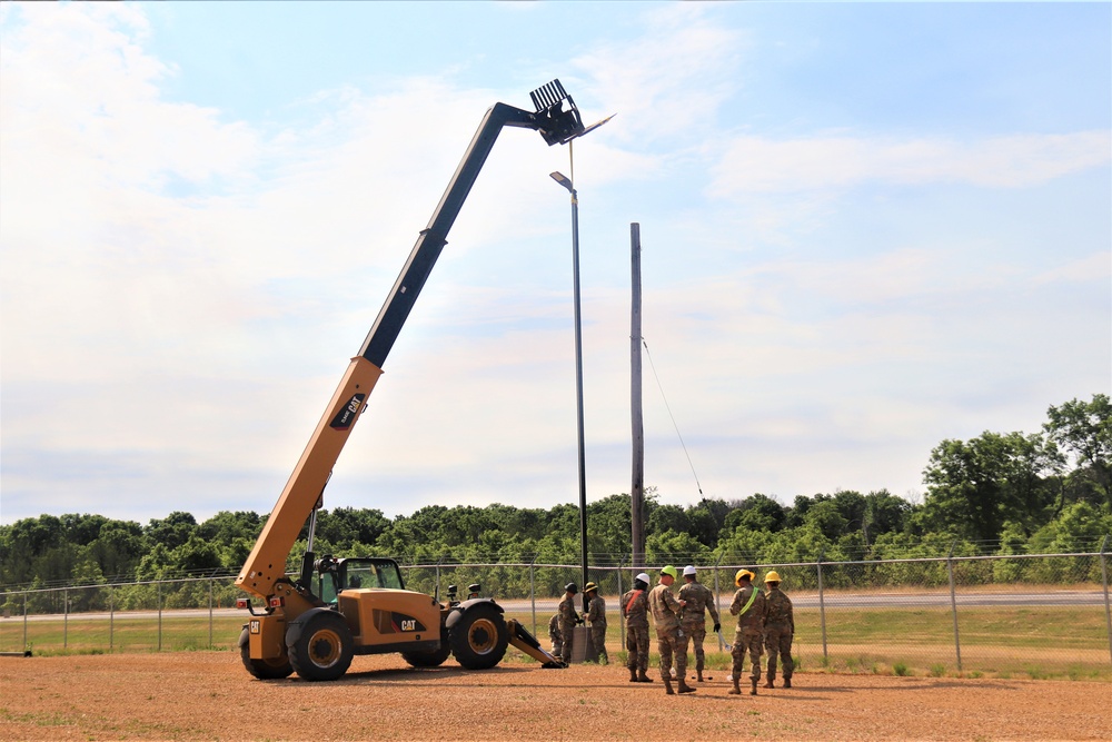 389th Engineer Company supports troop project to install light poles in Fort McCoy’s CRSP yard