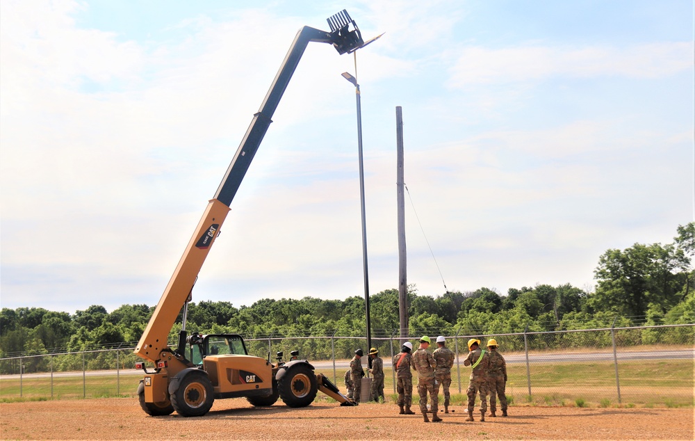 389th Engineer Company supports troop project to install light poles in Fort McCoy’s CRSP yard