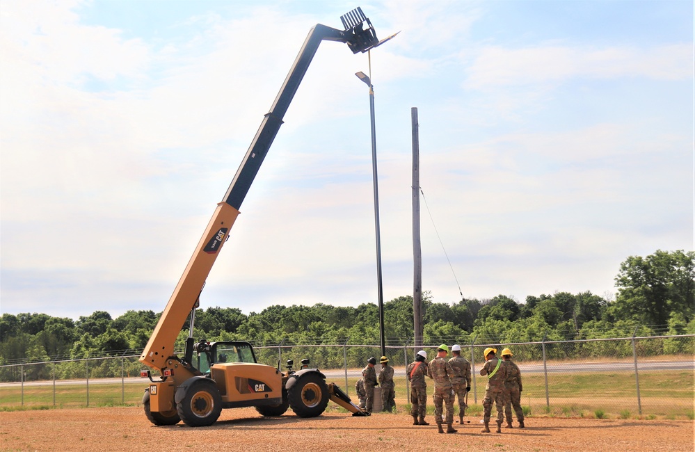 389th Engineer Company supports troop project to install light poles in Fort McCoy’s CRSP yard