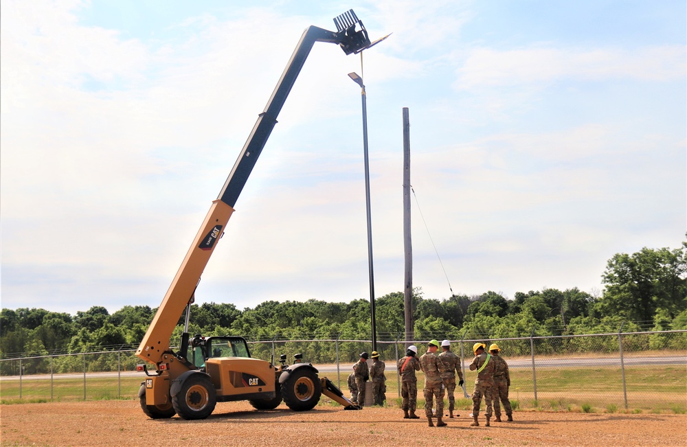 389th Engineer Company supports troop project to install light poles in Fort McCoy’s CRSP yard