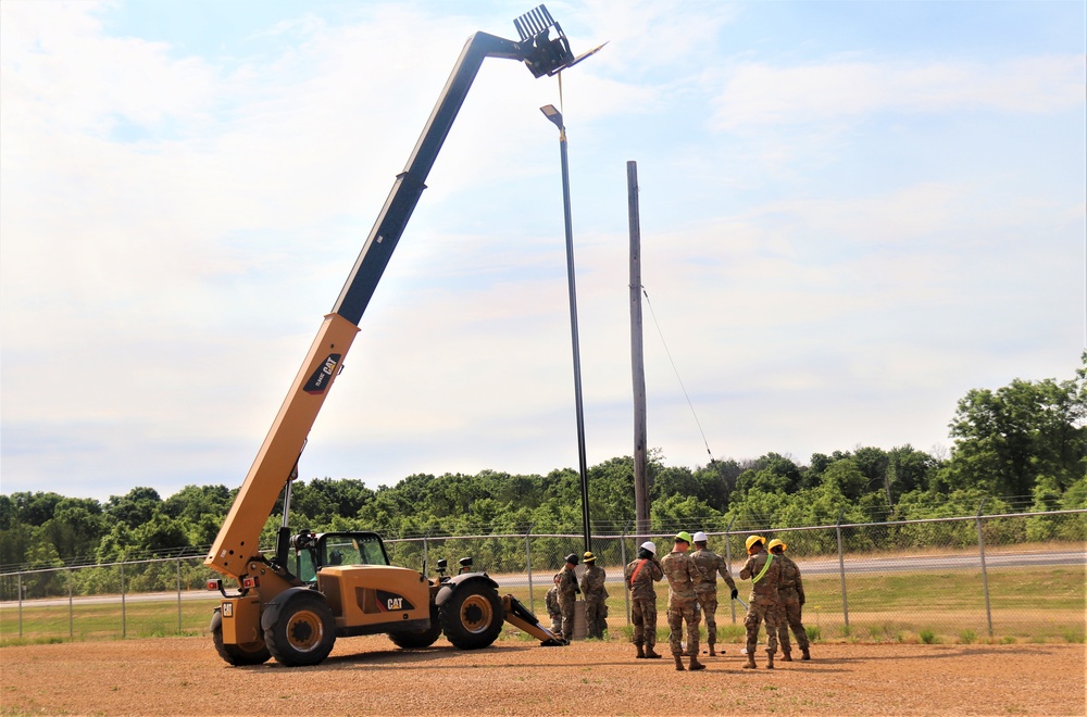 389th Engineer Company supports troop project to install light poles in Fort McCoy’s CRSP yard