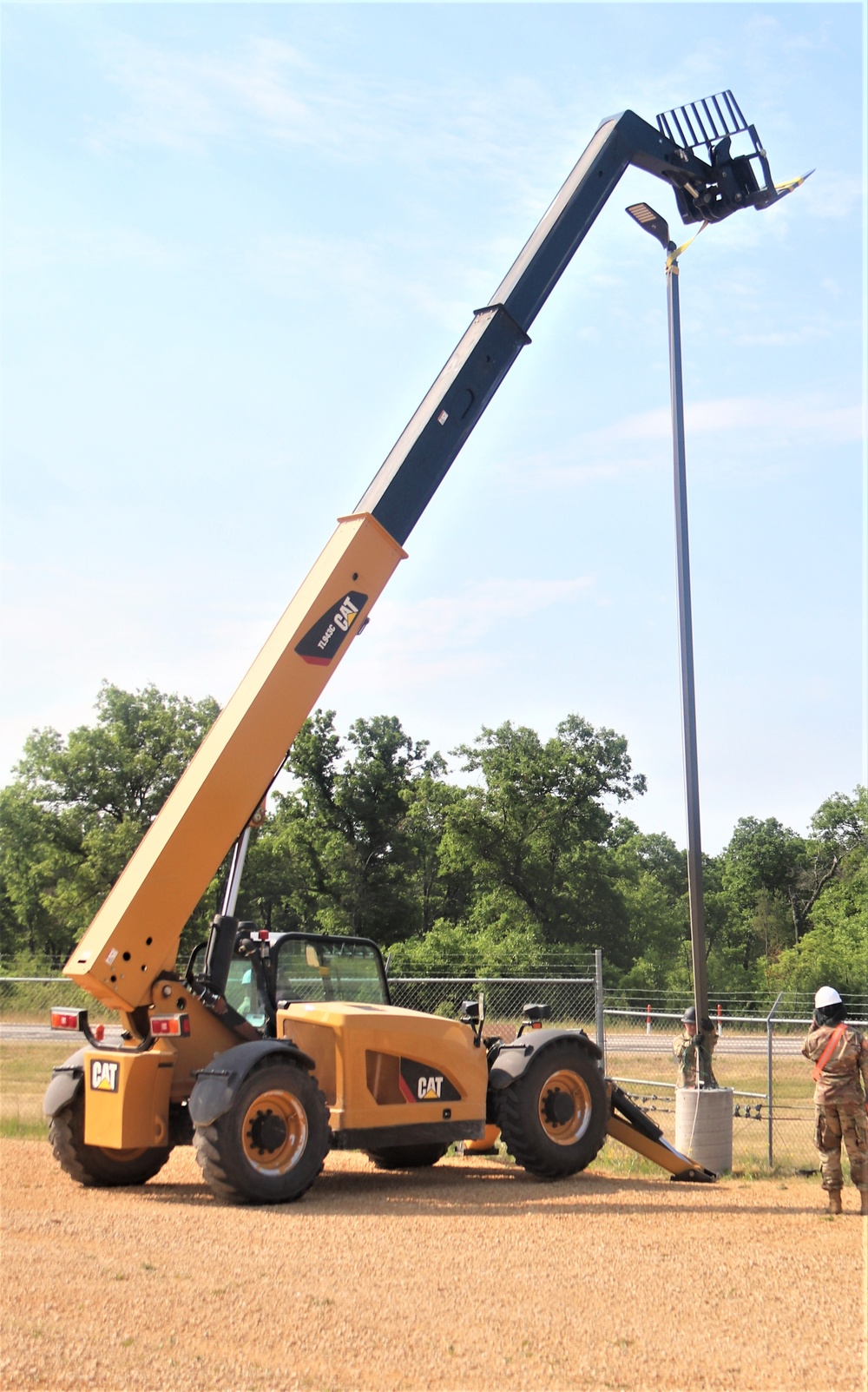 389th Engineer Company supports troop project to install light poles in Fort McCoy’s CRSP yard