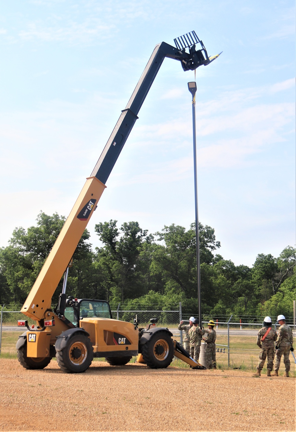 389th Engineer Company supports troop project to install light poles in Fort McCoy’s CRSP yard