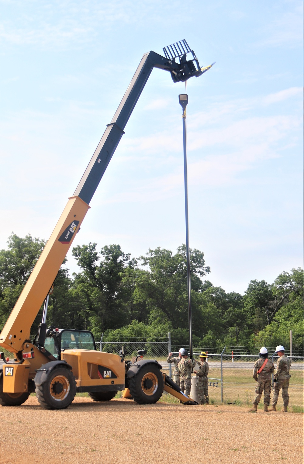 389th Engineer Company supports troop project to install light poles in Fort McCoy’s CRSP yard