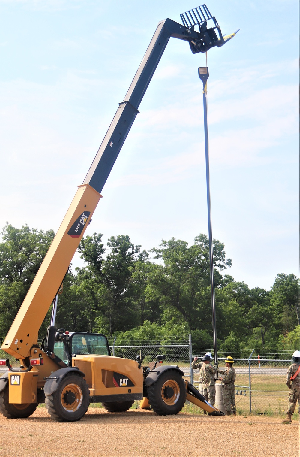 389th Engineer Company supports troop project to install light poles in Fort McCoy’s CRSP yard