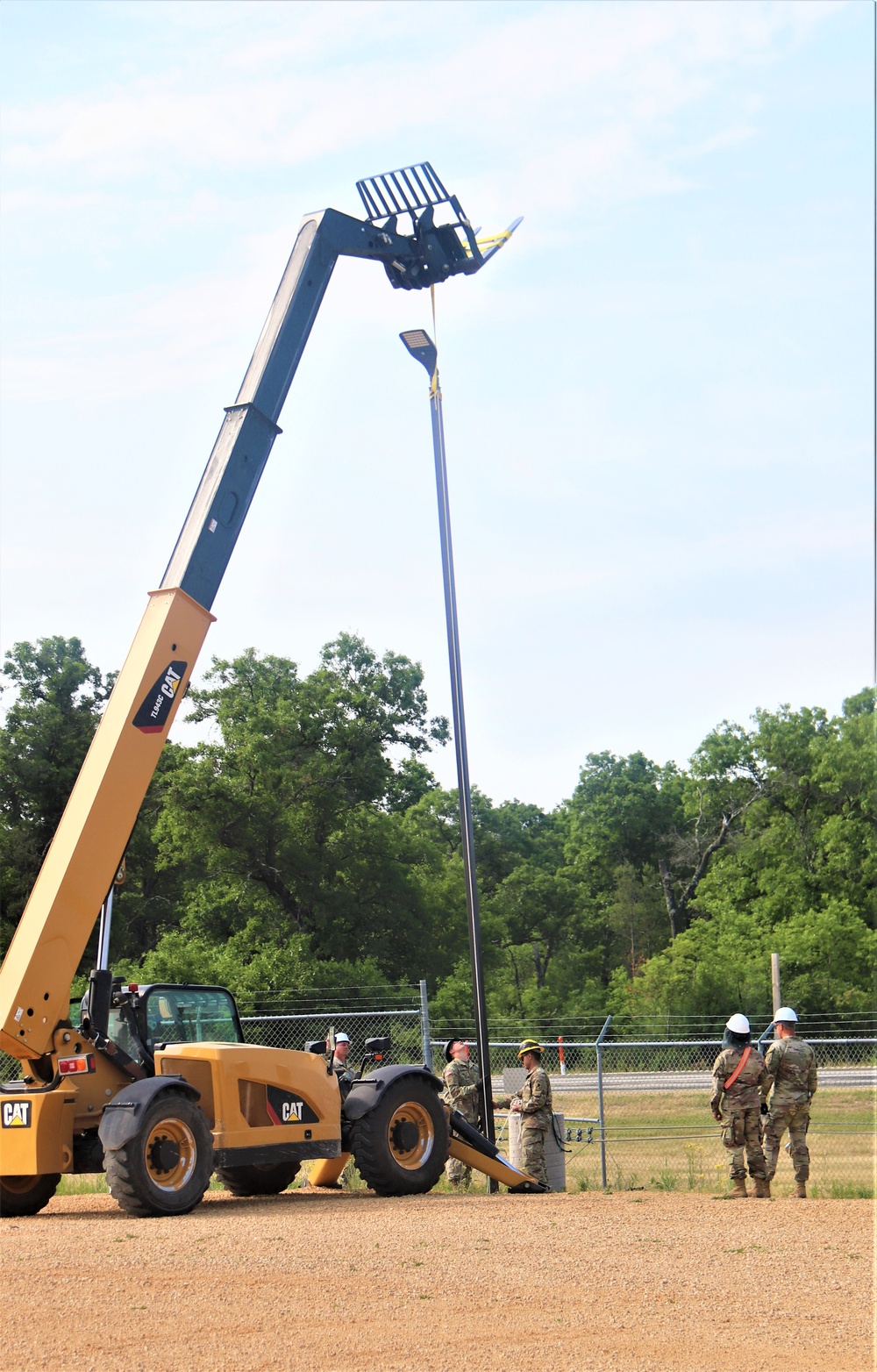 389th Engineer Company supports troop project to install light poles in Fort McCoy’s CRSP yard