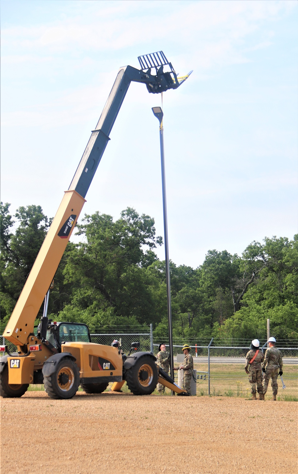 389th Engineer Company supports troop project to install light poles in Fort McCoy’s CRSP yard