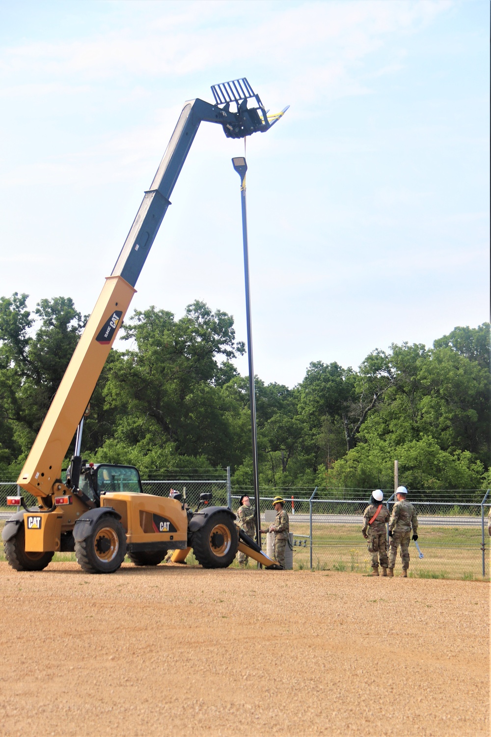 389th Engineer Company supports troop project to install light poles in Fort McCoy’s CRSP yard