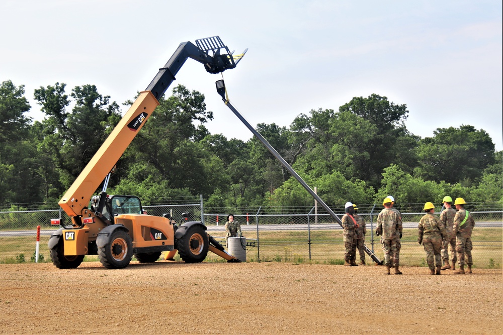 389th Engineer Company supports troop project to install light poles in Fort McCoy’s CRSP yard