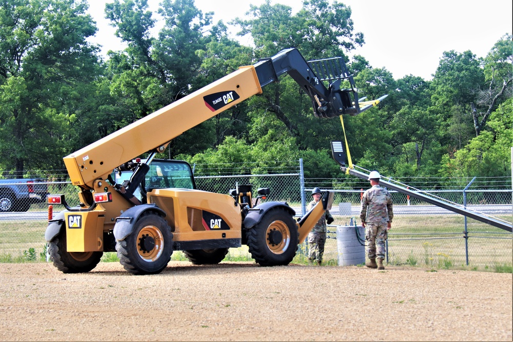 389th Engineer Company supports troop project to install light poles in Fort McCoy’s CRSP yard