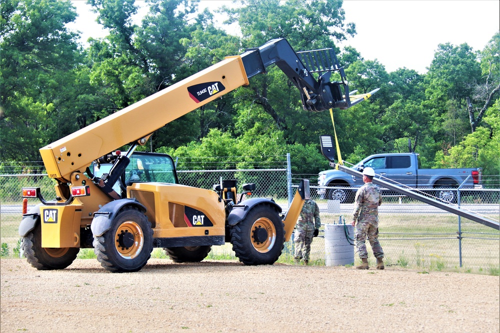 389th Engineer Company supports troop project to install light poles in Fort McCoy’s CRSP yard