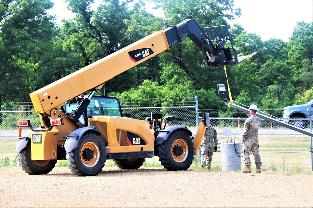 389th Engineer Company supports troop project to install light poles in Fort McCoy’s CRSP yard