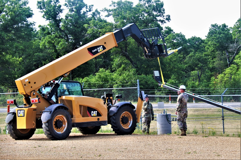 389th Engineer Company supports troop project to install light poles in Fort McCoy’s CRSP yard