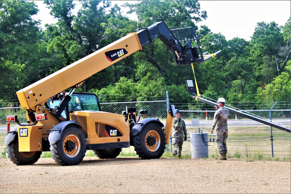 389th Engineer Company supports troop project to install light poles in Fort McCoy’s CRSP yard