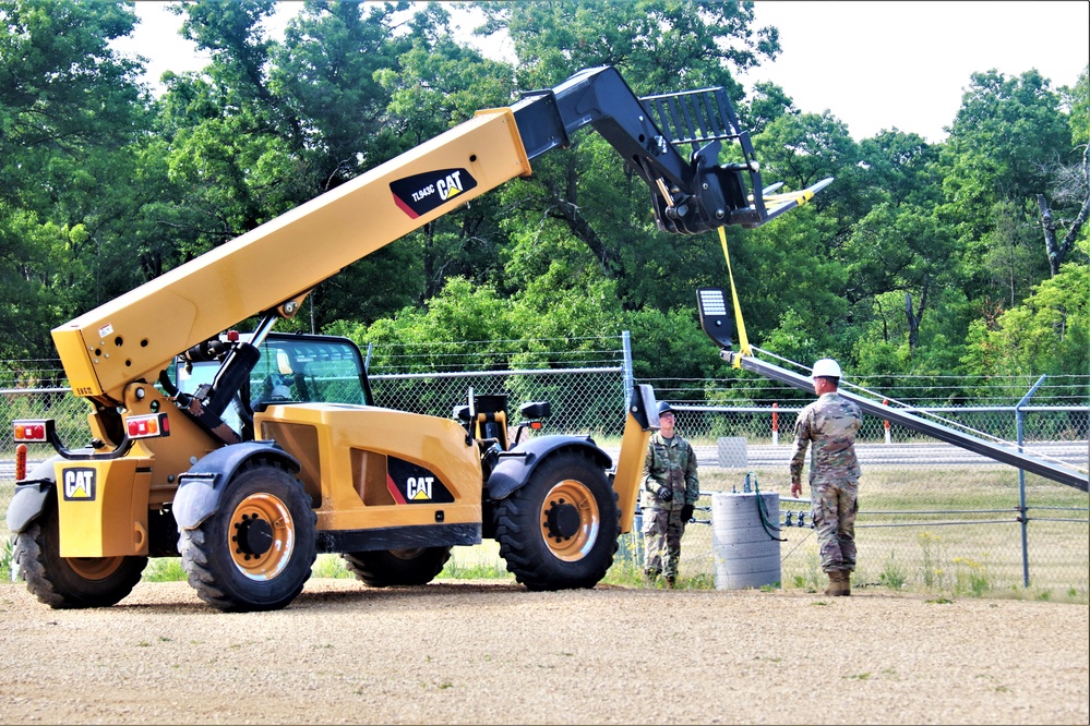 389th Engineer Company supports troop project to install light poles in Fort McCoy’s CRSP yard