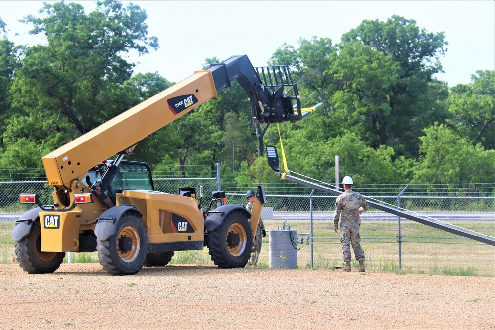 389th Engineer Company supports troop project to install light poles in Fort McCoy’s CRSP yard