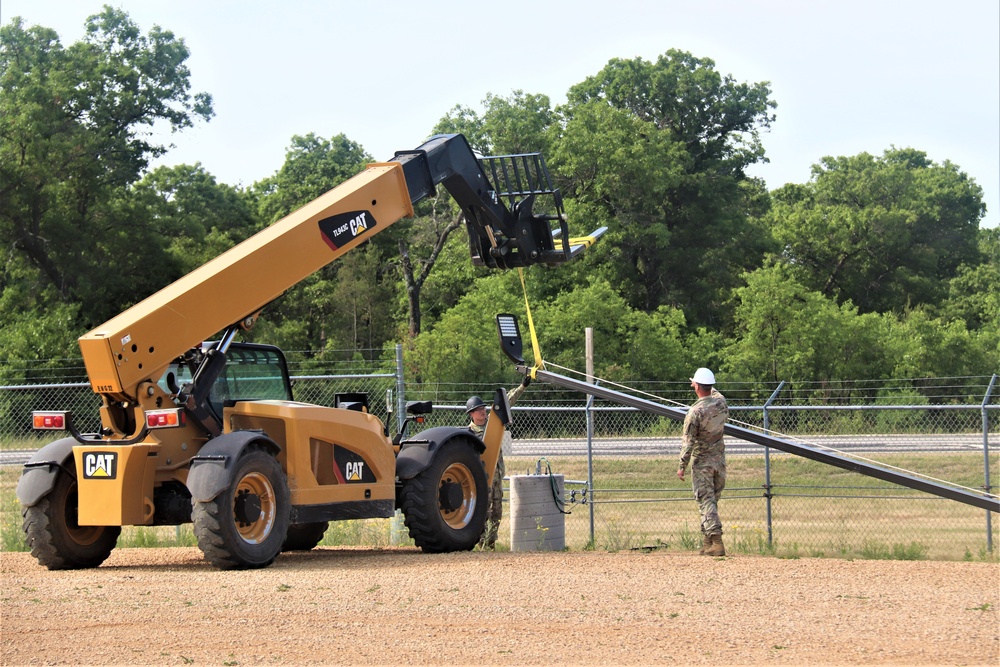 389th Engineer Company supports troop project to install light poles in Fort McCoy’s CRSP yard