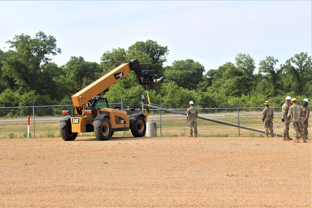 389th Engineer Company supports troop project to install light poles in Fort McCoy’s CRSP yard