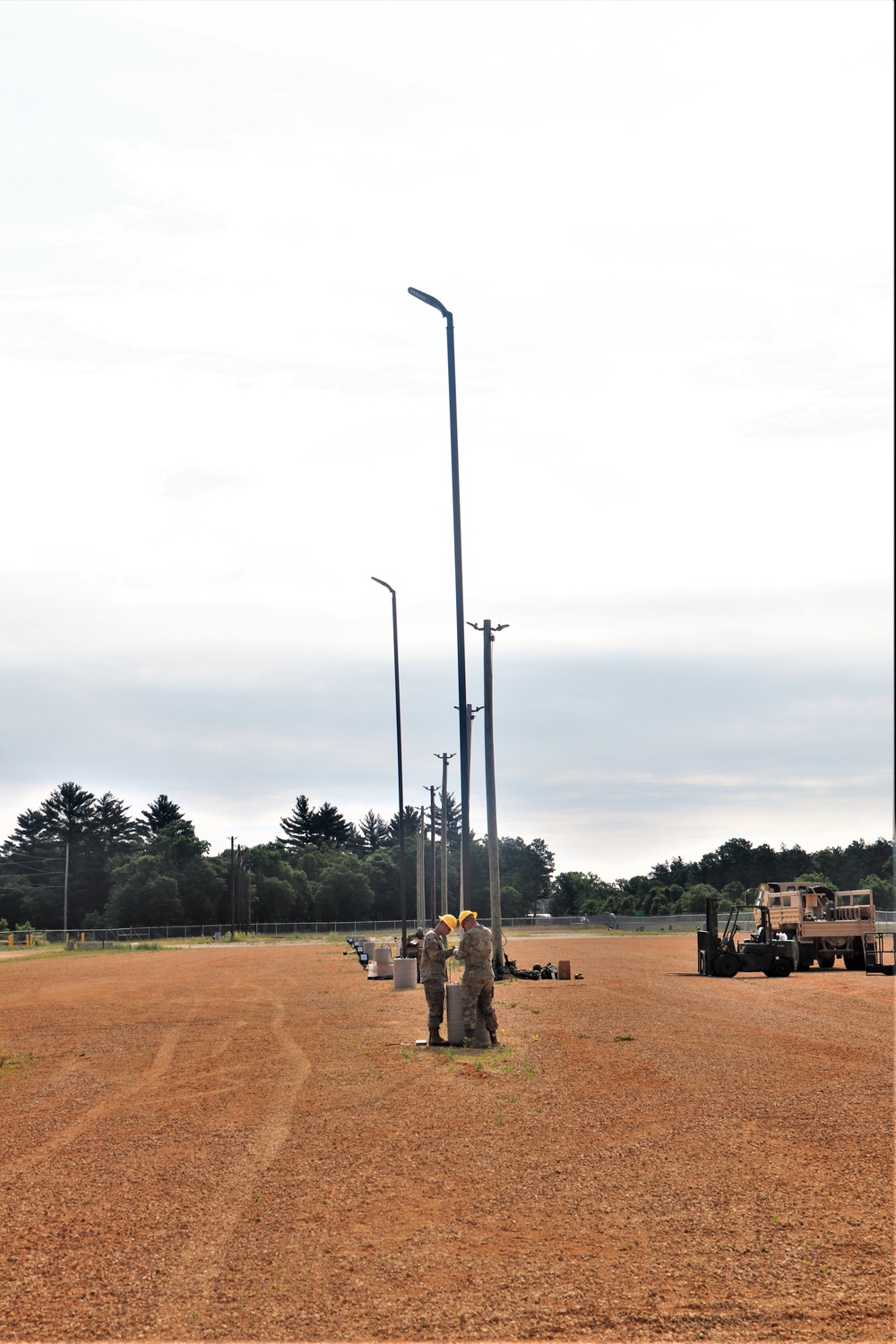 389th Engineer Company supports troop project to install light poles in Fort McCoy’s CRSP yard