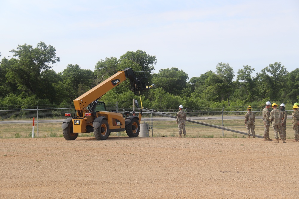 389th Engineer Company supports troop project to install light poles in Fort McCoy’s CRSP yard