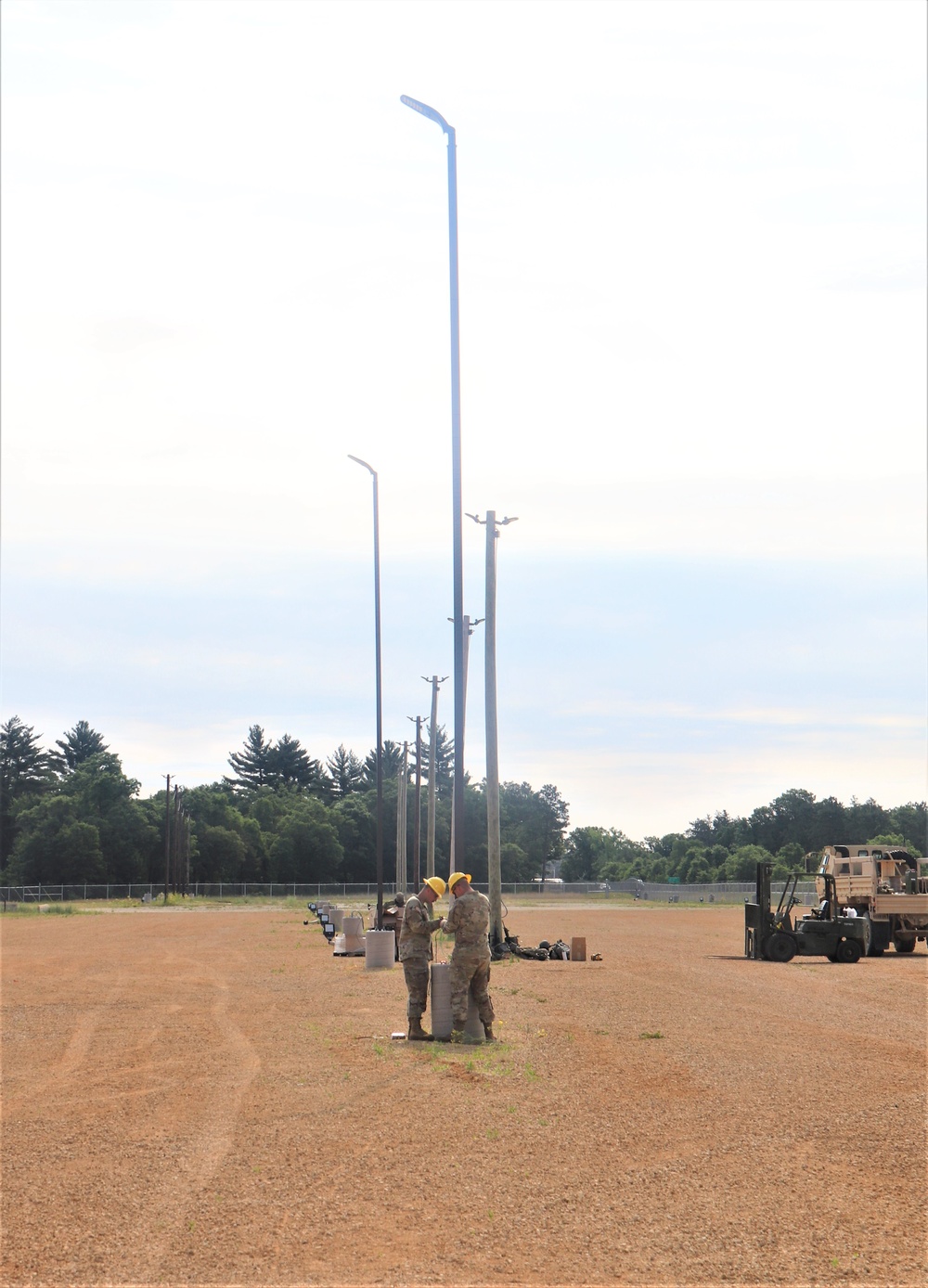 389th Engineer Company supports troop project to install light poles in Fort McCoy’s CRSP yard