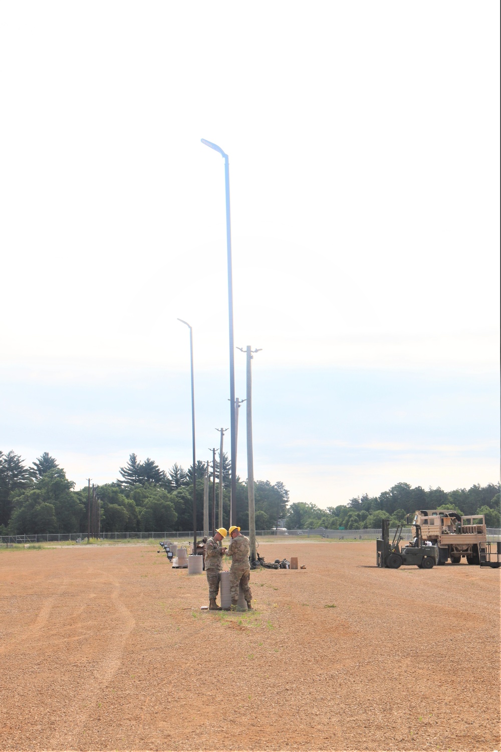 389th Engineer Company supports troop project to install light poles in Fort McCoy’s CRSP yard