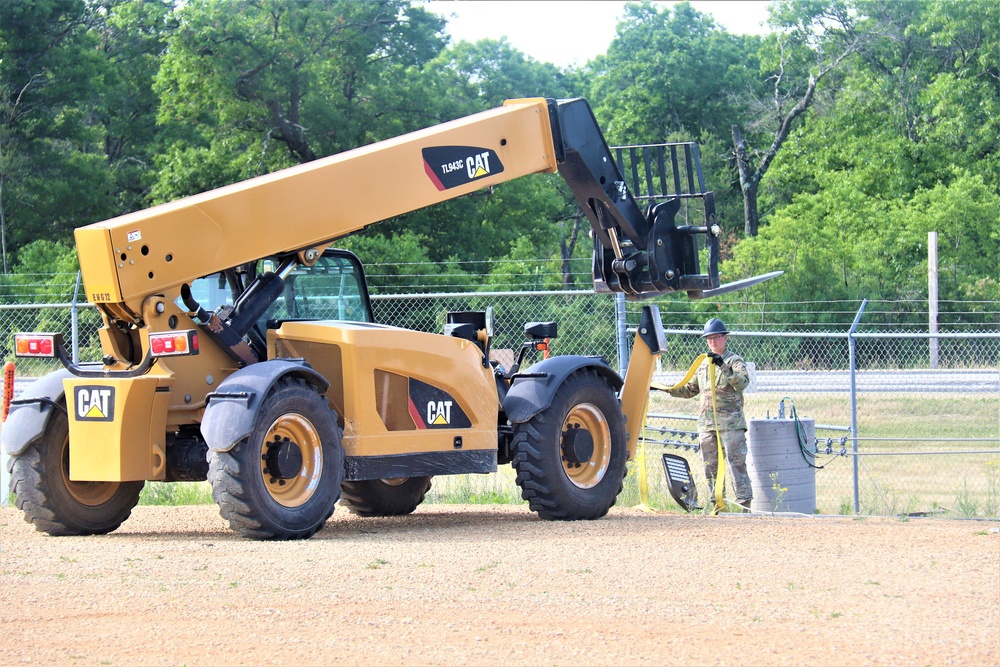 389th Engineer Company supports troop project to install light poles in Fort McCoy’s CRSP yard