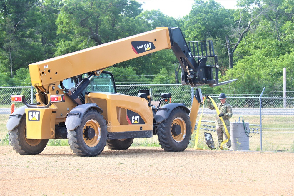 389th Engineer Company supports troop project to install light poles in Fort McCoy’s CRSP yard