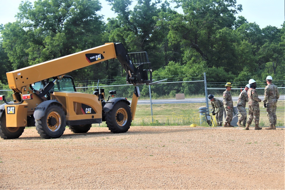 389th Engineer Company supports troop project to install light poles in Fort McCoy’s CRSP yard
