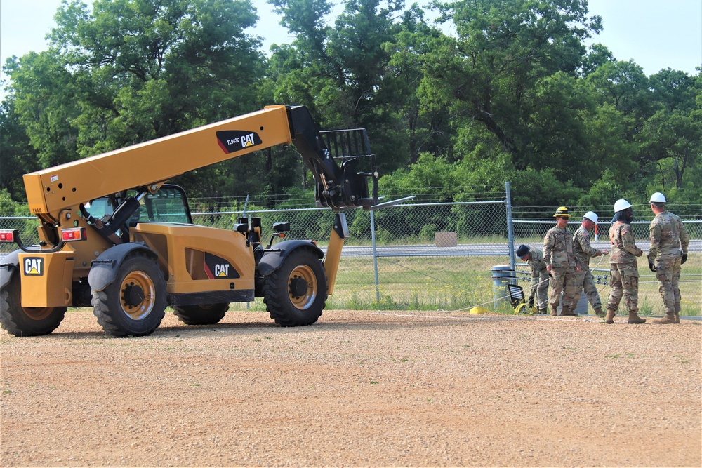 389th Engineer Company supports troop project to install light poles in Fort McCoy’s CRSP yard