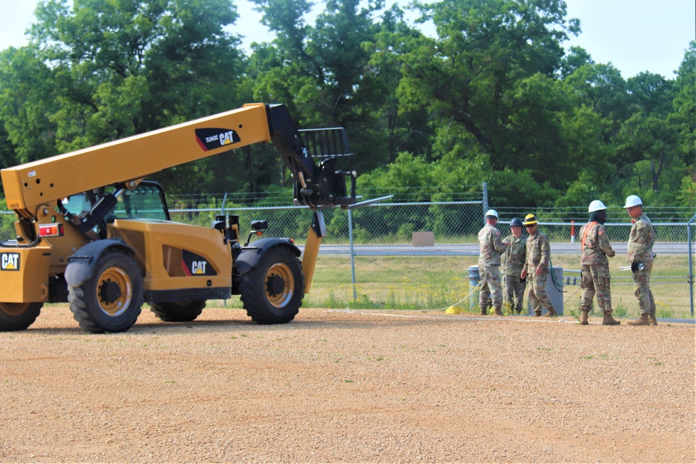 389th Engineer Company supports troop project to install light poles in Fort McCoy’s CRSP yard