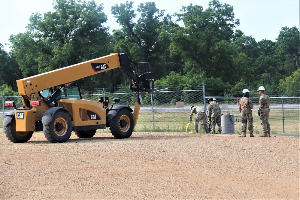 389th Engineer Company supports troop project to install light poles in Fort McCoy’s CRSP yard