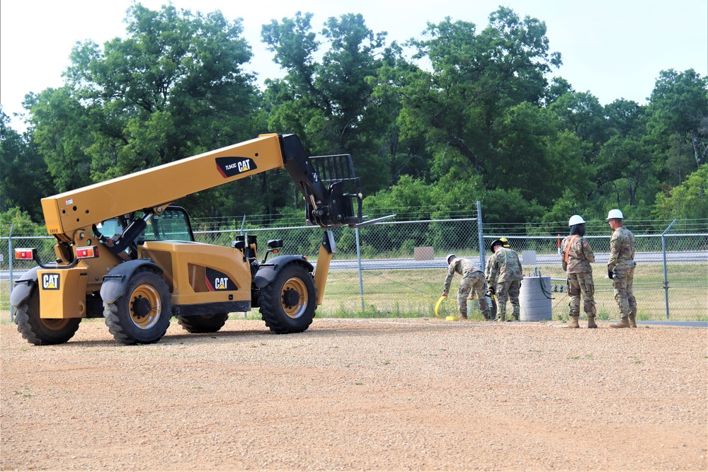 389th Engineer Company supports troop project to install light poles in Fort McCoy’s CRSP yard