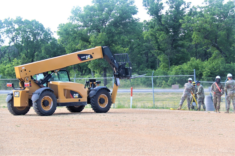 389th Engineer Company supports troop project to install light poles in Fort McCoy’s CRSP yard