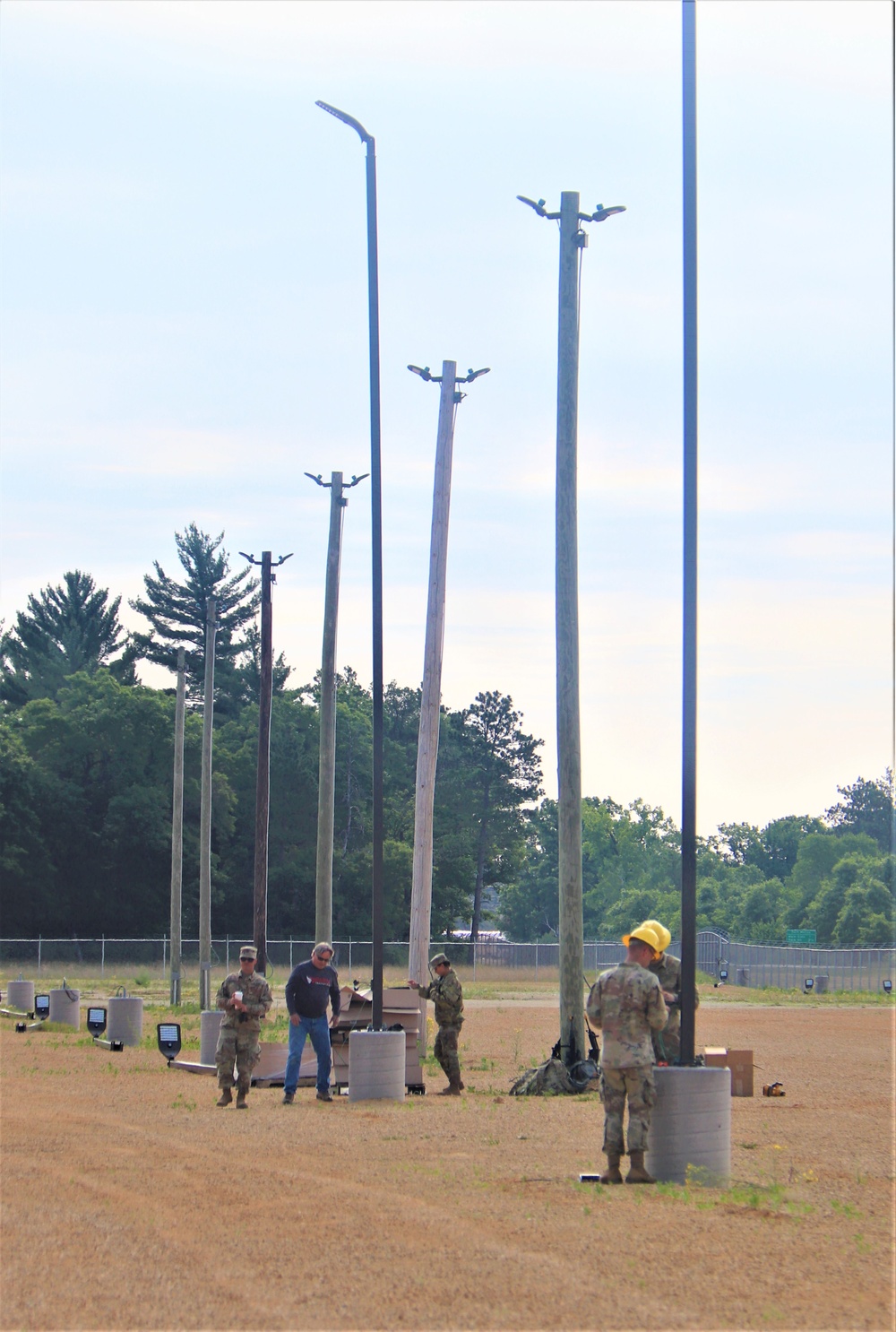 389th Engineer Company supports troop project to install light poles in Fort McCoy’s CRSP yard